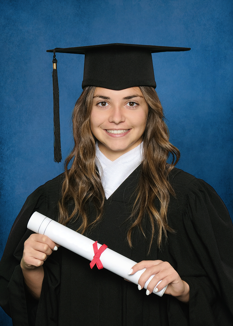 A high school graduate portrait taken by Studio NanC of a young girl wearing a black graduation cap and gown holding a diploma.